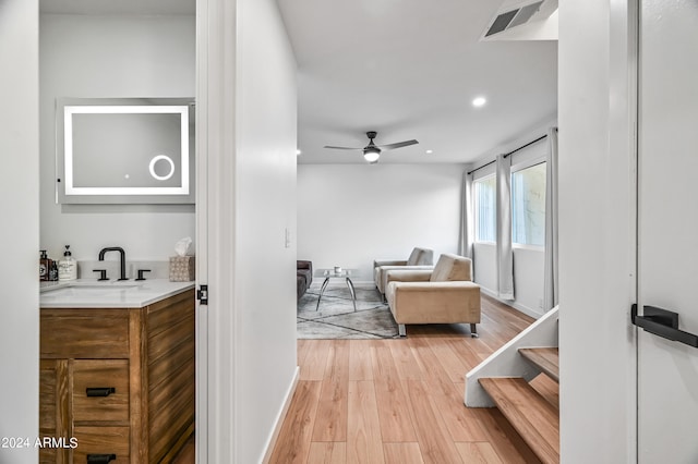 interior space with sink and light hardwood / wood-style floors