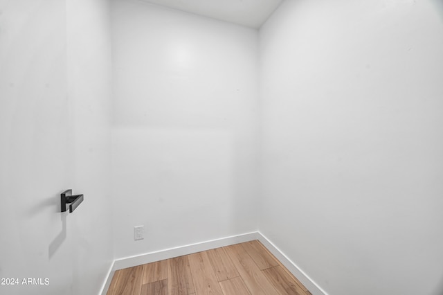 spare room with wood-type flooring