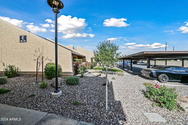 view of home's exterior featuring a carport