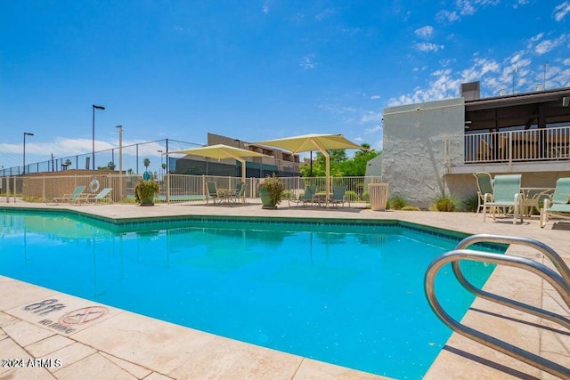 view of swimming pool featuring a patio area