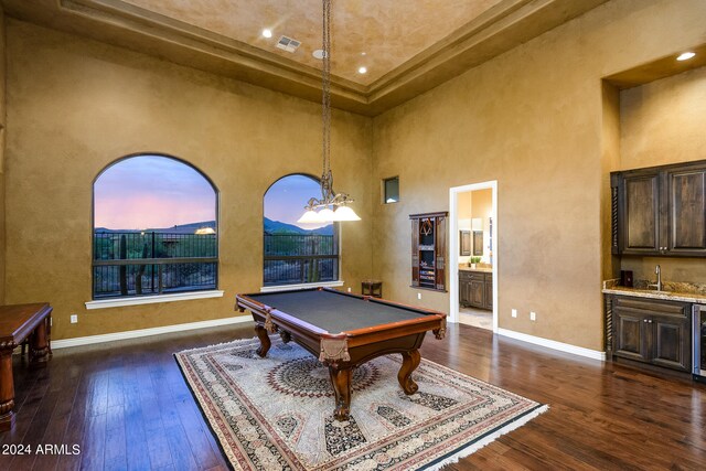 rec room featuring billiards, beverage cooler, a high ceiling, dark hardwood / wood-style floors, and sink