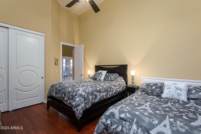 bedroom featuring a closet, ceiling fan, high vaulted ceiling, and dark hardwood / wood-style flooring