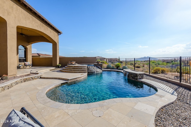 view of swimming pool featuring a patio and pool water feature