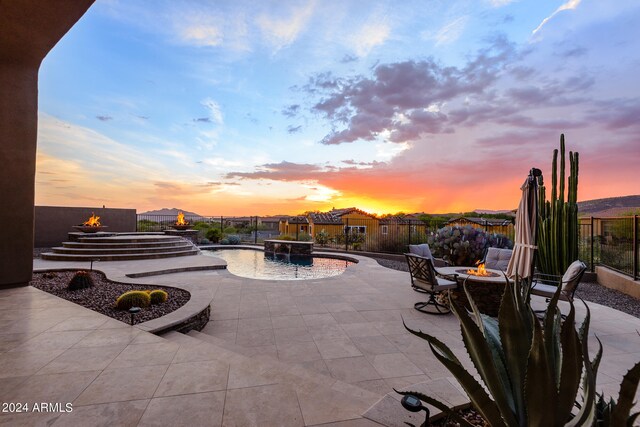 patio terrace at dusk with a fire pit