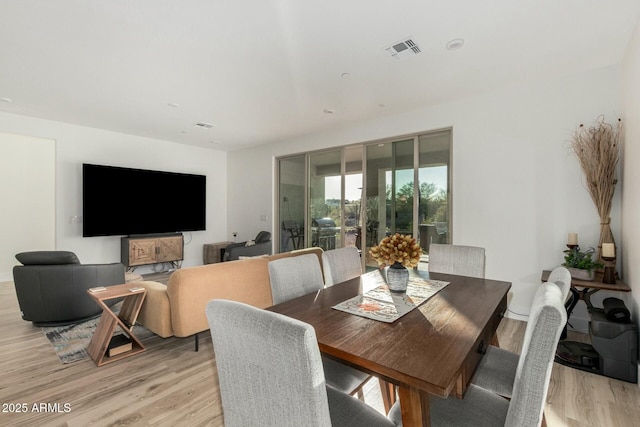 dining space featuring light hardwood / wood-style floors