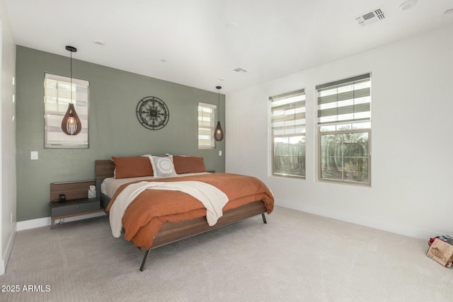 bedroom with light colored carpet