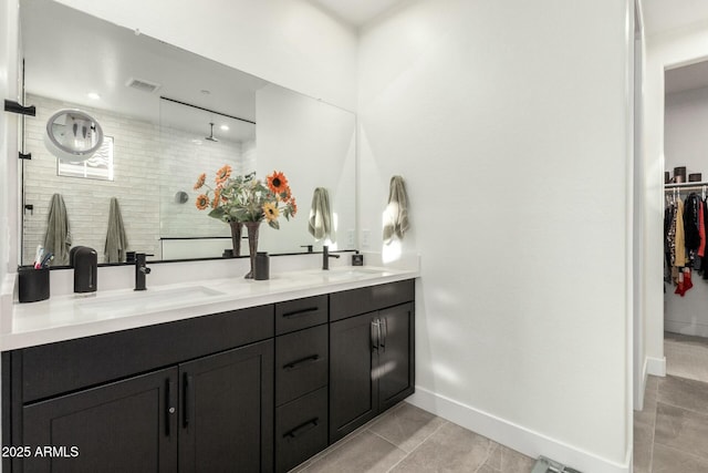 bathroom with vanity, tile patterned floors, and walk in shower