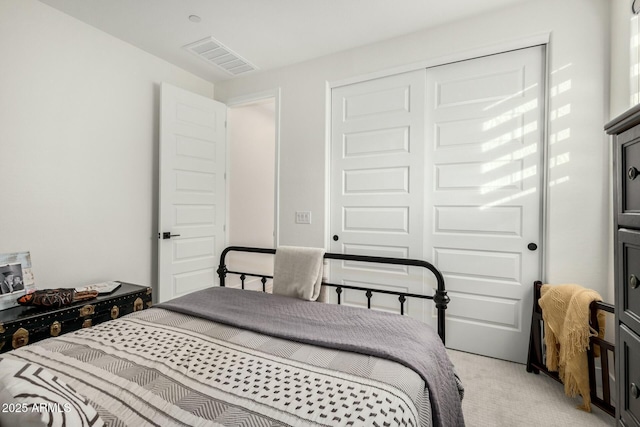 carpeted bedroom featuring a closet