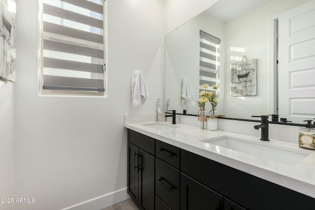 bathroom with a healthy amount of sunlight and vanity