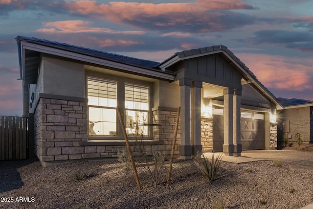 property exterior at dusk with a garage