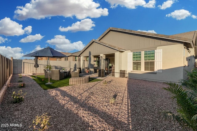 back of house with a patio