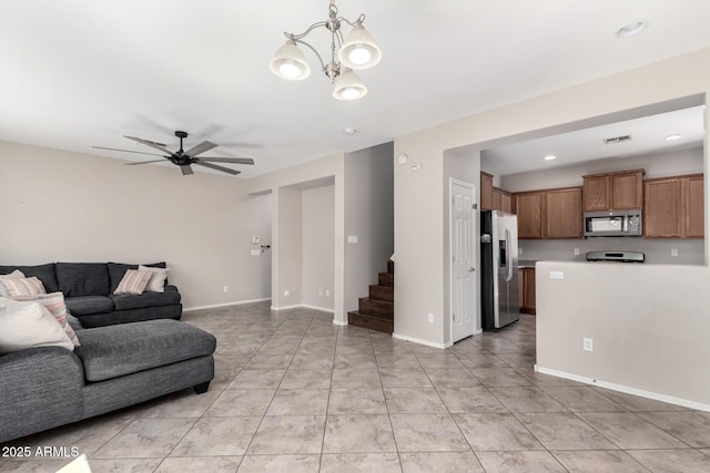 9148 W Meadow Dr, Peoria, AZ 85382 - living room with stairway, ceiling fan, a chandelier, recessed lighting, and baseboards
