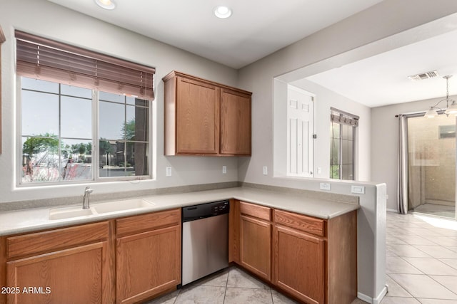 9148 W Meadow Dr, Peoria, AZ 85382 - kitchen featuring stainless steel dishwasher, a sink, a peninsula, healthy amount of natural light, and recessed lighting