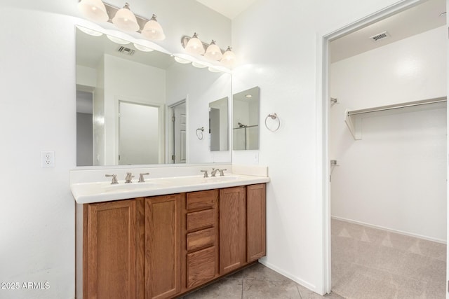 9148 W Meadow Dr, Peoria, AZ 85382 - full bathroom featuring double vanity, a spacious closet, and tile patterned flooring