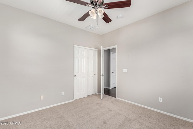 9148 W Meadow Dr, Peoria, AZ 85382 - unfurnished bedroom featuring carpet flooring, baseboards, a closet, and ceiling fan