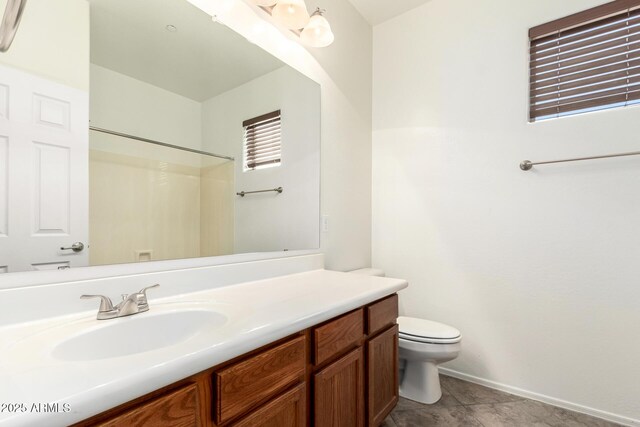 9148 W Meadow Dr, Peoria, AZ 85382 - bathroom featuring toilet, vanity, a shower, and baseboards