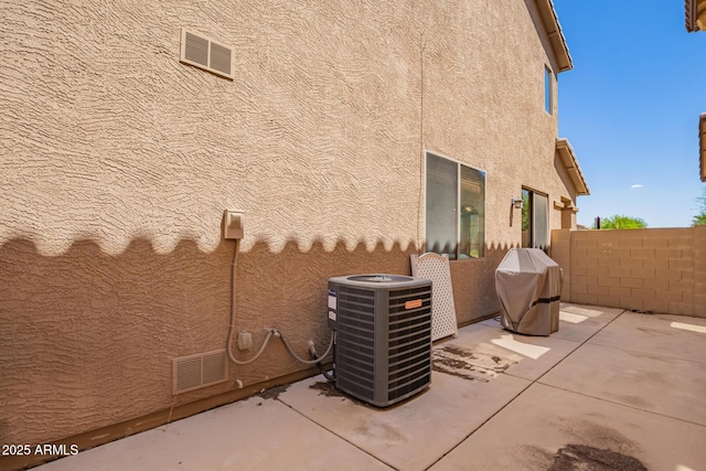 9148 W Meadow Dr, Peoria, AZ 85382 - view of property exterior with central air condition unit, a patio area, stucco siding, and fence