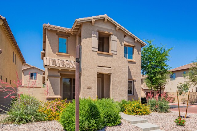 9148 W Meadow Dr, Peoria, AZ 85382 - view of front facade with stucco siding, a tiled roof, and fence