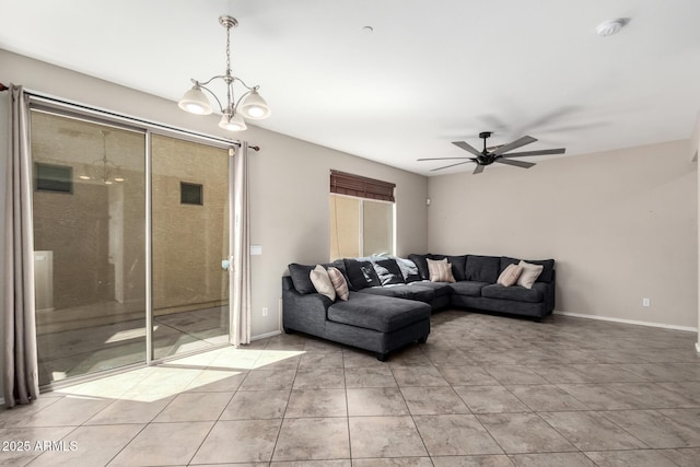 9148 W Meadow Dr, Peoria, AZ 85382 - living area with a chandelier, ceiling fan, light tile patterned floors, and baseboards