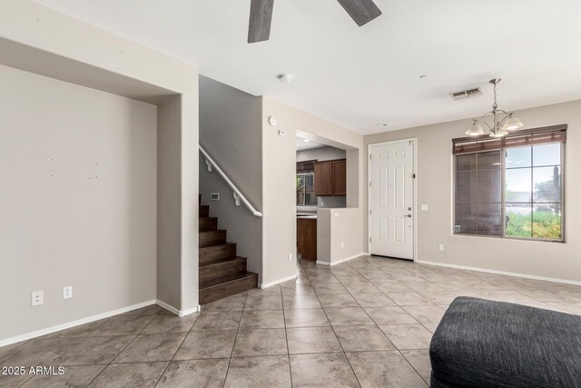 9148 W Meadow Dr, Peoria, AZ 85382 - entrance foyer with a ceiling fan, stairway, light tile patterned floors, a chandelier, and baseboards