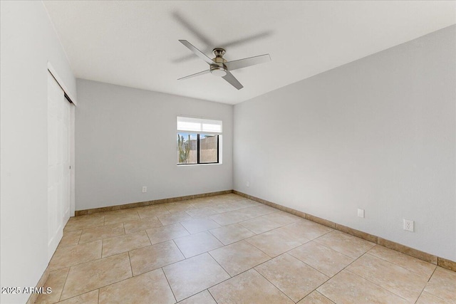 unfurnished bedroom with ceiling fan, light tile patterned floors, and a closet