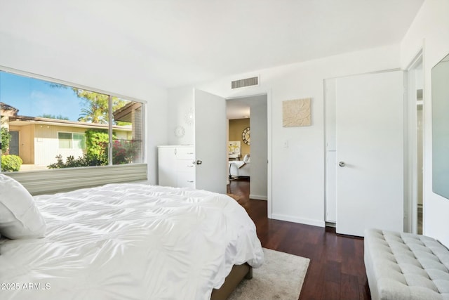 bedroom featuring dark wood-type flooring