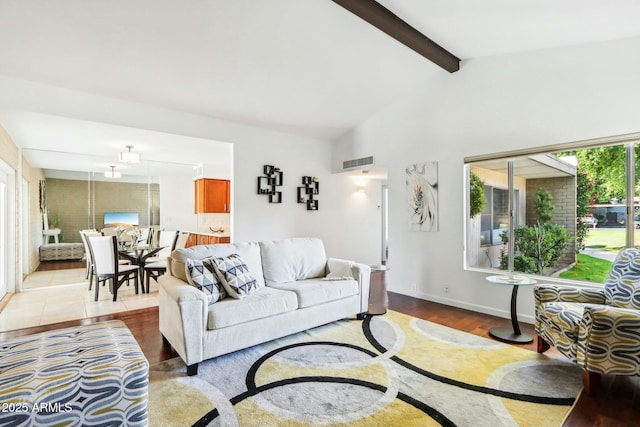 living room with hardwood / wood-style flooring and lofted ceiling with beams