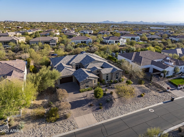 birds eye view of property with a residential view and a mountain view