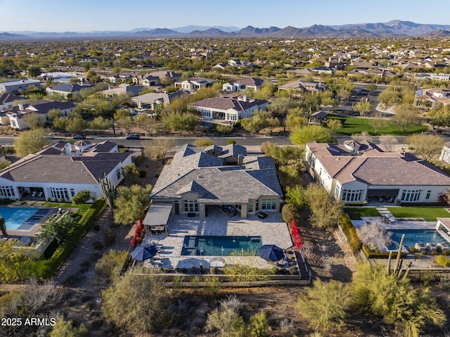 aerial view featuring a mountain view and a residential view