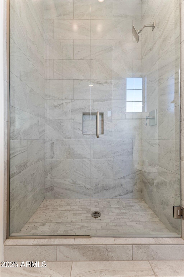 bathroom featuring a shower stall