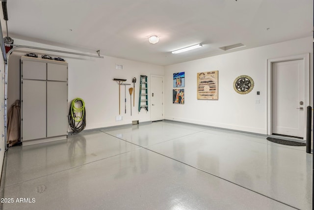 garage featuring baseboards