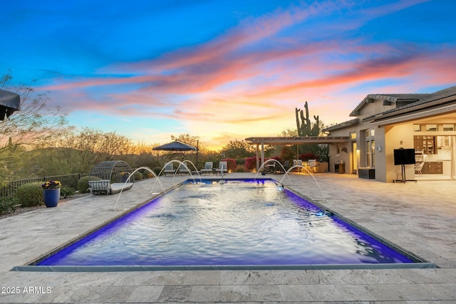 view of swimming pool with a patio, fence, and a fenced in pool