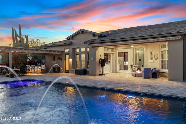 outdoor pool with a patio area and a pergola