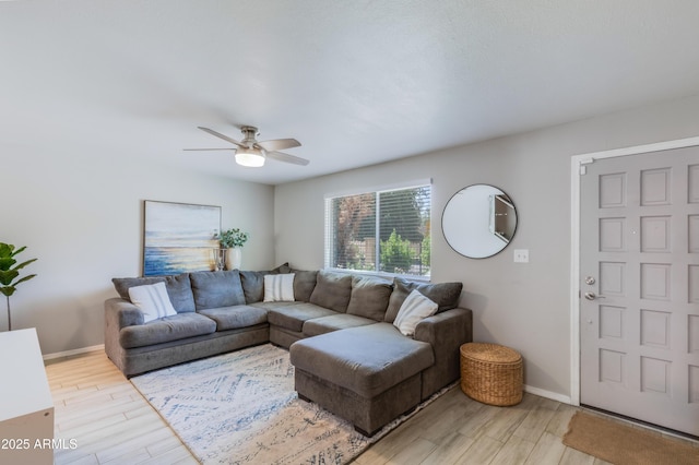 8135 N Central Ave Unit 1, Phoenix, AZ 85020 - living area featuring light wood-style flooring, ceiling fan, and baseboards