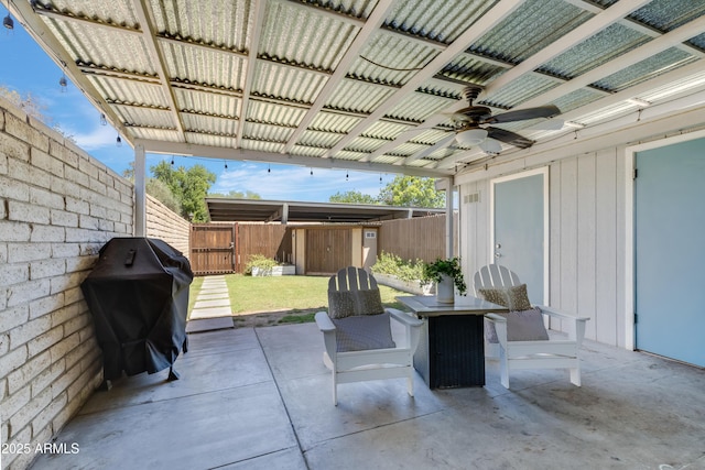 8135 N Central Ave Unit 1, Phoenix, AZ 85020 - view of patio featuring ceiling fan, a grill, and a fenced backyard