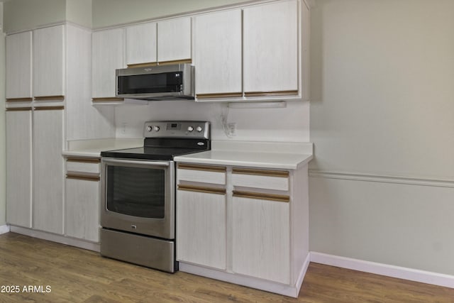 3345 E University Dr Unit 2, Mesa, AZ 85213 - kitchen featuring stainless steel appliances, light countertops, and light wood-style floors