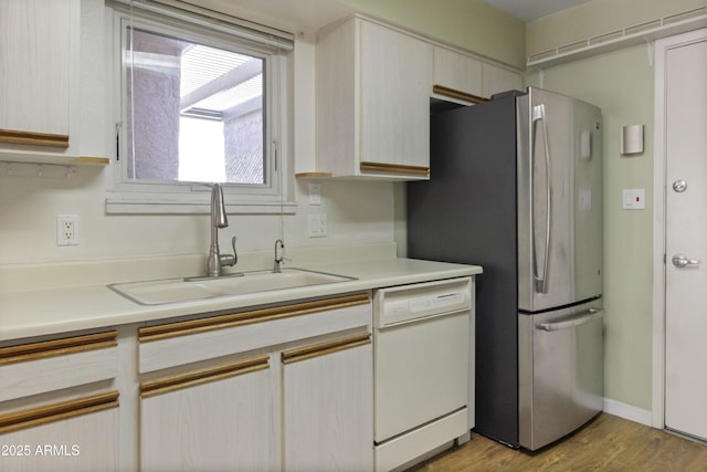 3345 E University Dr Unit 2, Mesa, AZ 85213 - kitchen with dishwasher, freestanding refrigerator, light countertops, and light wood-type flooring