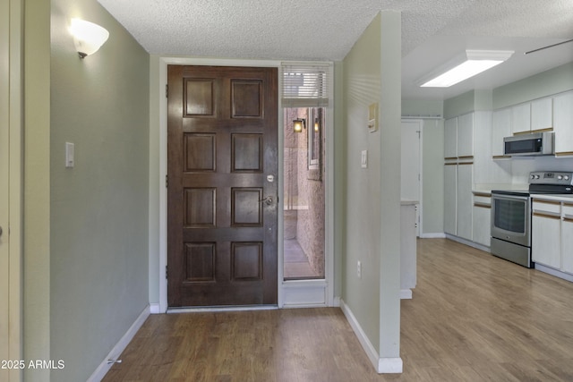 3345 E University Dr Unit 2, Mesa, AZ 85213 - foyer entrance featuring a textured ceiling and light wood-style floors