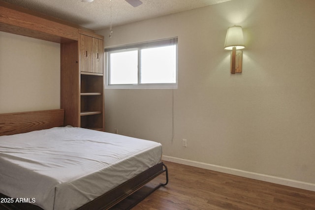 3345 E University Dr Unit 2, Mesa, AZ 85213 - bedroom with wood finished floors, a textured ceiling, and a ceiling fan