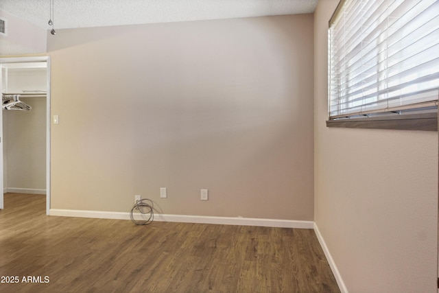 3345 E University Dr Unit 2, Mesa, AZ 85213 - unfurnished bedroom with wood finished floors and a closet