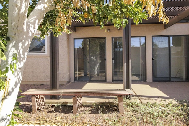 3345 E University Dr Unit 2, Mesa, AZ 85213 - rear view of house featuring stucco siding, a pergola, and a patio area