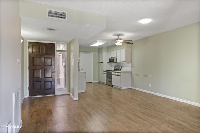 3345 E University Dr Unit 2, Mesa, AZ 85213 - foyer with ceiling fan, wood finished floors, and a textured ceiling