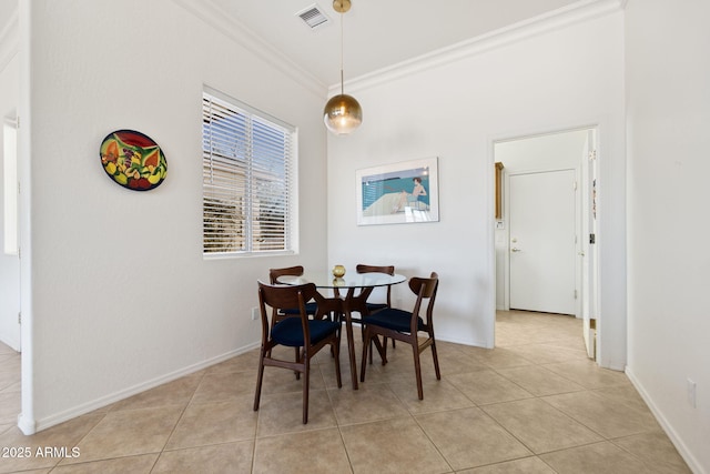 tiled dining area with crown molding