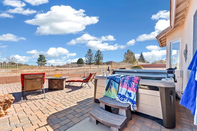 view of patio / terrace with an outdoor fire pit