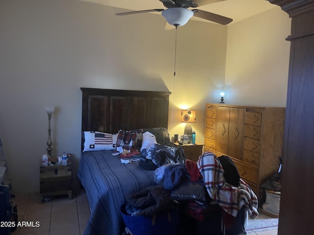 tiled bedroom with ceiling fan