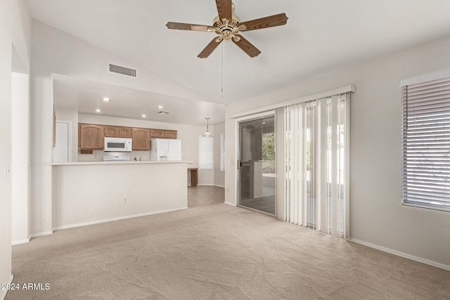 unfurnished living room with light colored carpet, ceiling fan, and lofted ceiling