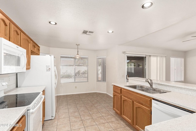 kitchen featuring ceiling fan, sink, pendant lighting, white appliances, and light tile patterned flooring