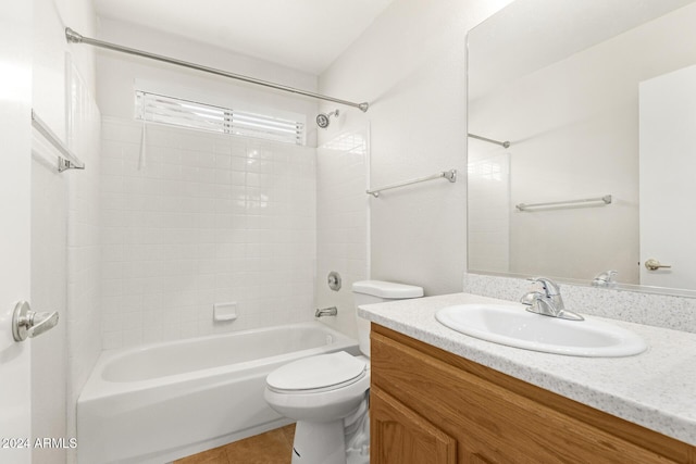 full bathroom with tile patterned flooring, vanity, toilet, and tiled shower / bath