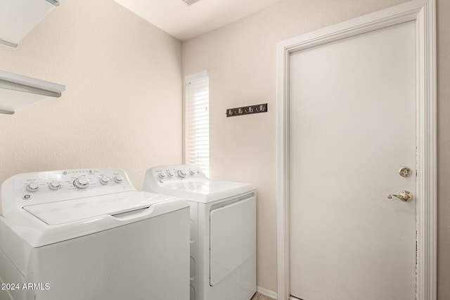 laundry room with washer and clothes dryer