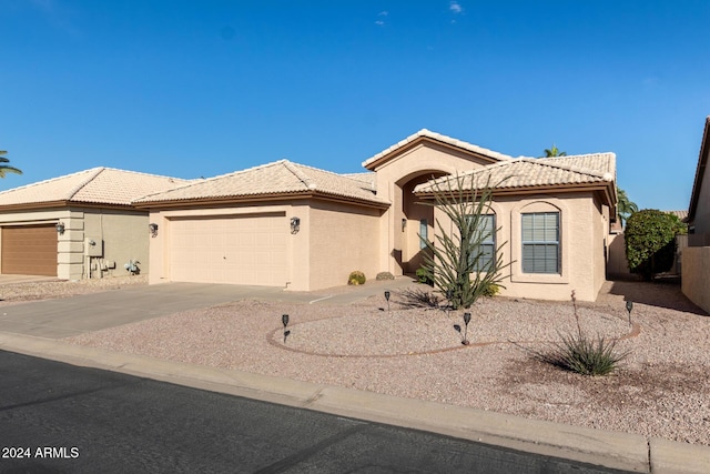 view of front of home with a garage